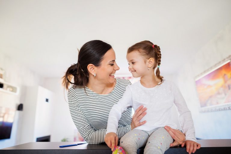 Mother enjoying time with her daughter at home