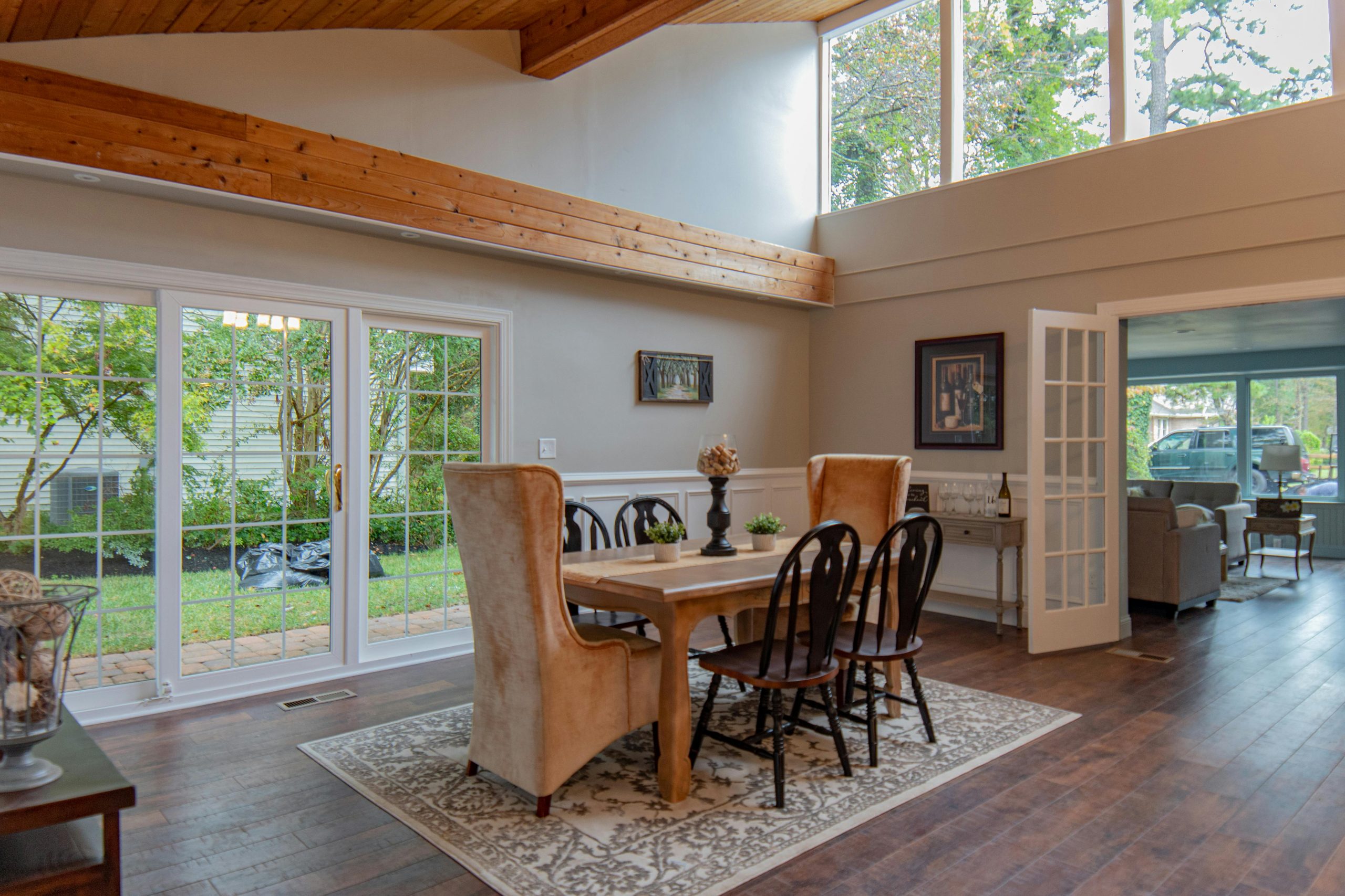 modern tudor style dining room with a Persian rug under the dining set
