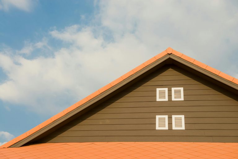 orange gable roof under clear skies