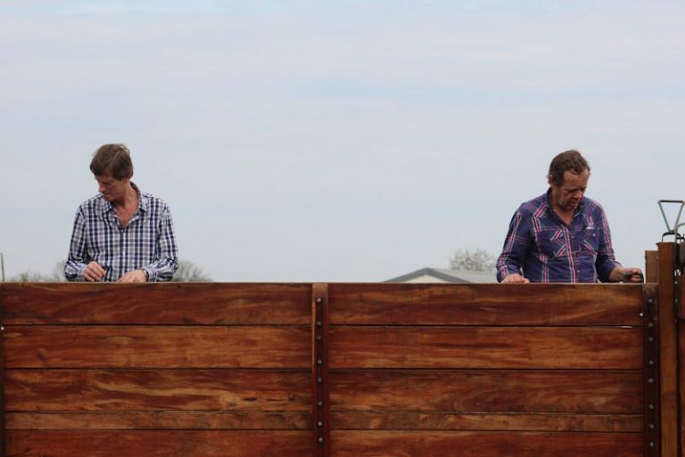 men installing a fence