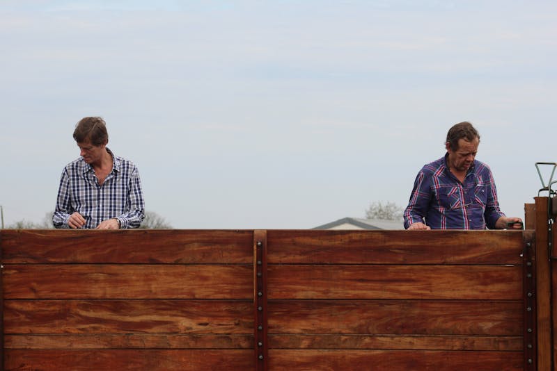 men installing a fence